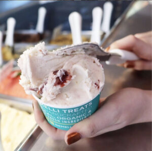 Gelato being scooped with a spatula